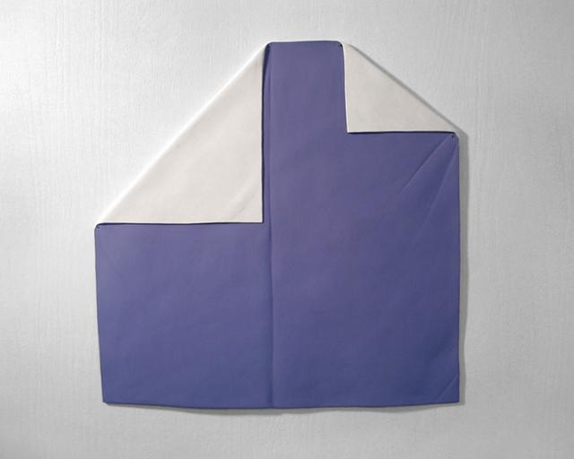 Purple cloth with white edges folded down