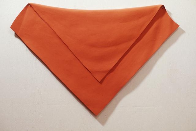 Orange cloth, folded diagonally with long side at top
