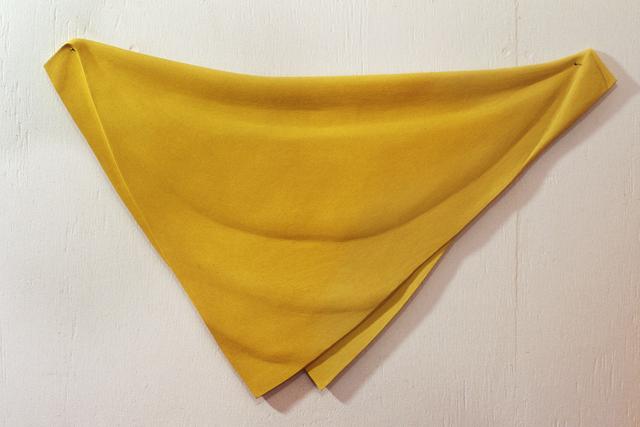 Yellow cloth, folded diagonally with long side at top