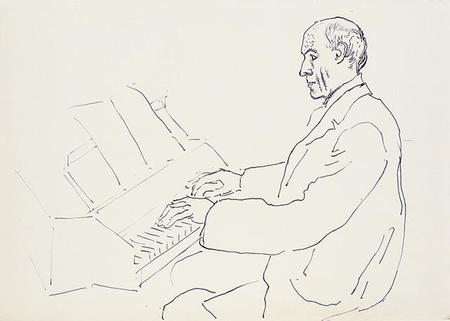 Man seated at piano