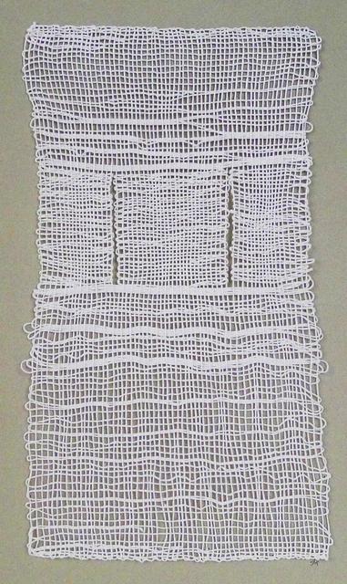 White weaving on tan paper