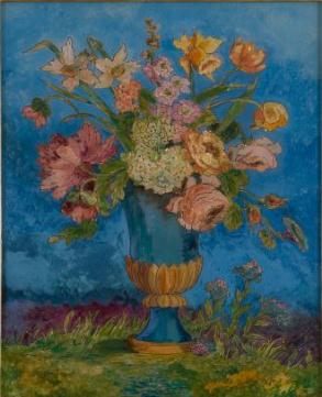 Pink, yellow, and white flowers in blue vase on green grassy ground in front of blue wall
