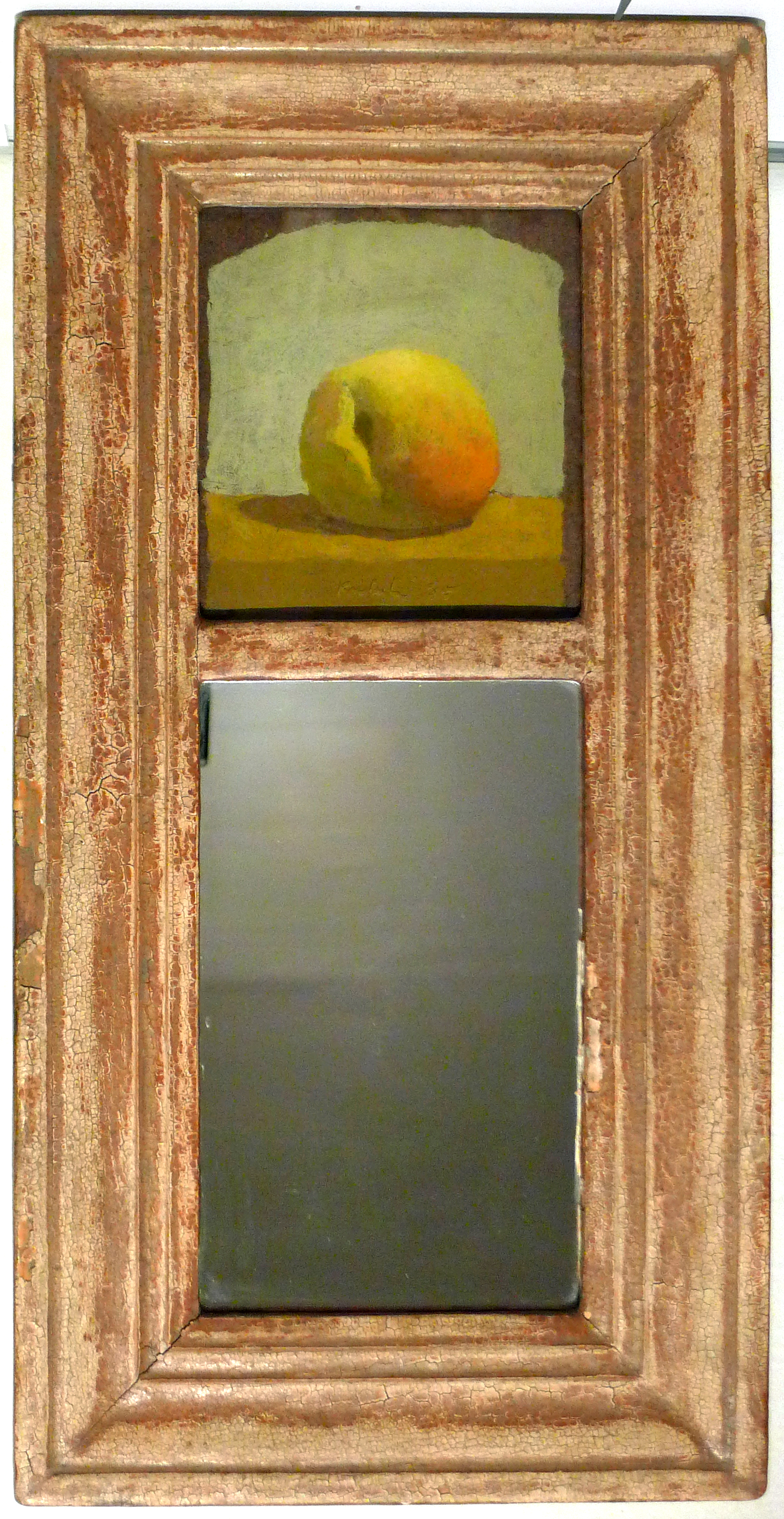 Yellow peach on brown table at top centerr in tall rectangular frame with mirror at lower centerr