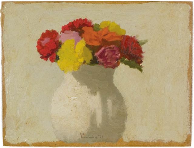 Vase with yellow, pink, and red flowers in white vase