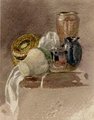 Still life with brown, black and white pots, with white cloth and assorted objects on brown table