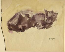 Black cat laying on its side on tan paper