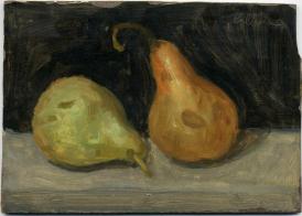 Green and brown pears on grey surface with black backround