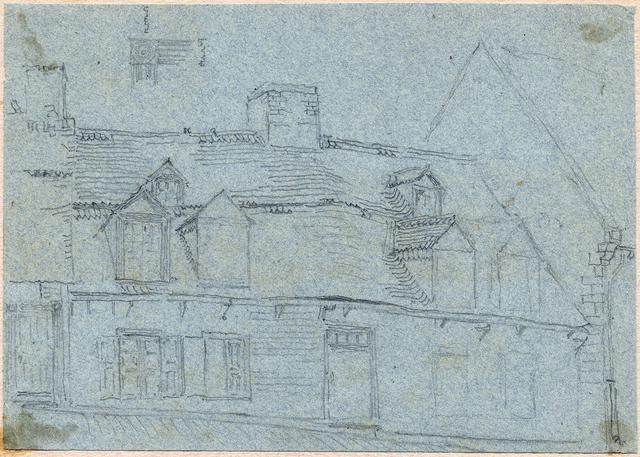 House with lumpy roof and multiple window outcroppings with individual peaks