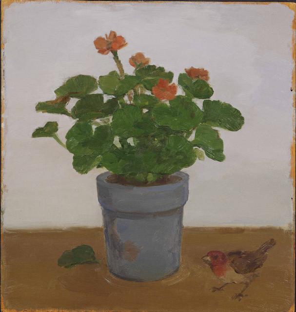 Red geraniums and leaves in blue pot with single fallen leaf at left and bird with red head at right on brown table