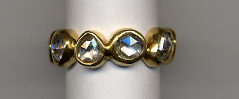 Diamond ring on white cylinder