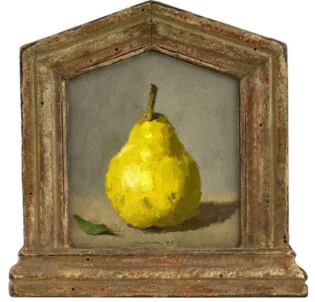 Green pear with stem and green leaf on table in ornate gold frame