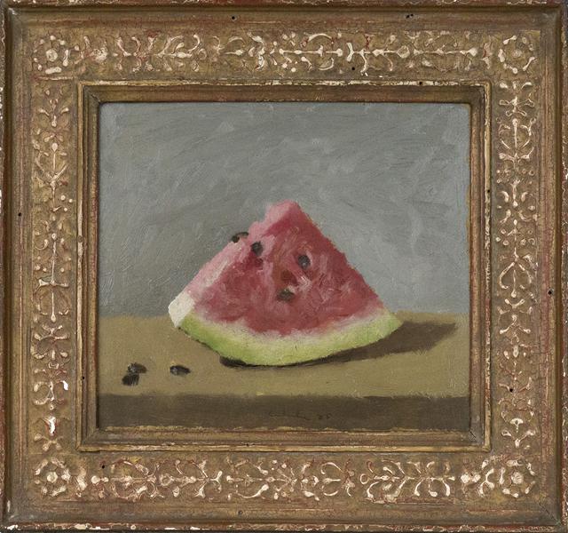 Wedge of watermelon with seeds and three seeds at left on table