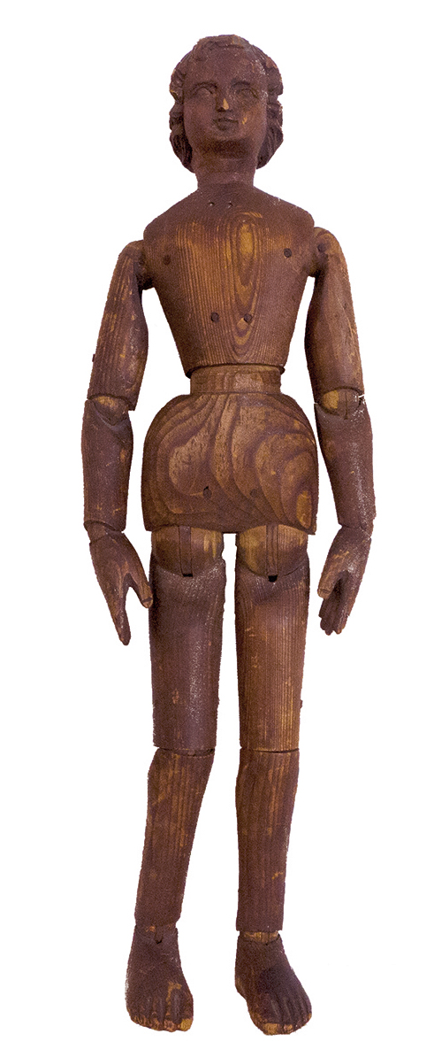 Wooden lay figure laid flat on white ground