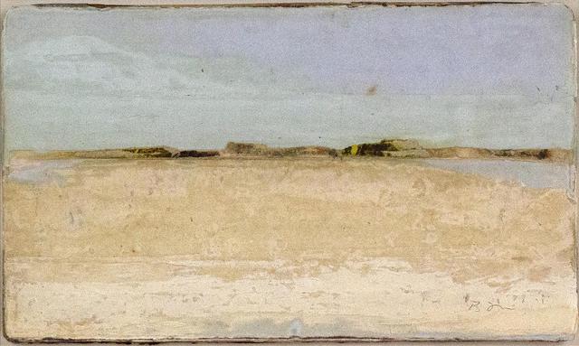 Sandy landscape with green hills at horizon and blue sky