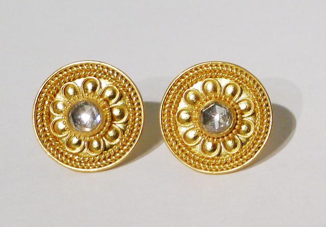 Gould circular earrings with ornate braided decorations and diamonds at center