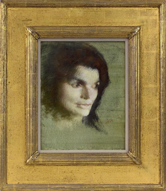 Head of a pale dark haired woman looking down and to the side