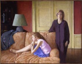 Interior scene with a young girl sitting on the couch facing left with a woman standing to her right with her hand on the couch