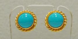 Turquoise circles in gold braided circles on plastic earring stand