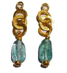Light blue bead earrings below gold interconnected circular loops