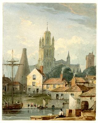 River with houses and boats and cathedral at top of small hill