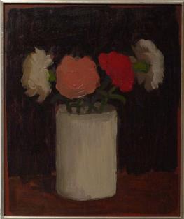 Pink flower, red flower, and two white flowers in white cylindrical vase on table with black background