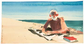 Man laying on stomach with beard, laying on towel on beach next to book with sea in background