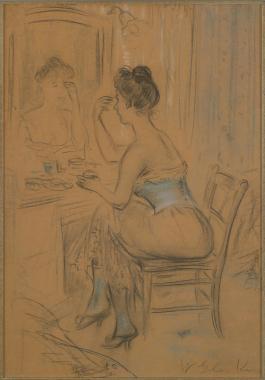 Woman seated in chair looking into her mirror applying makeup