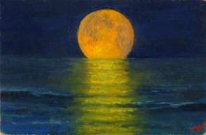Orange moon above sea reflected in the water